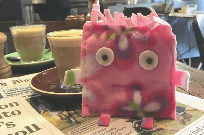 a hand sewn softie with a coffee